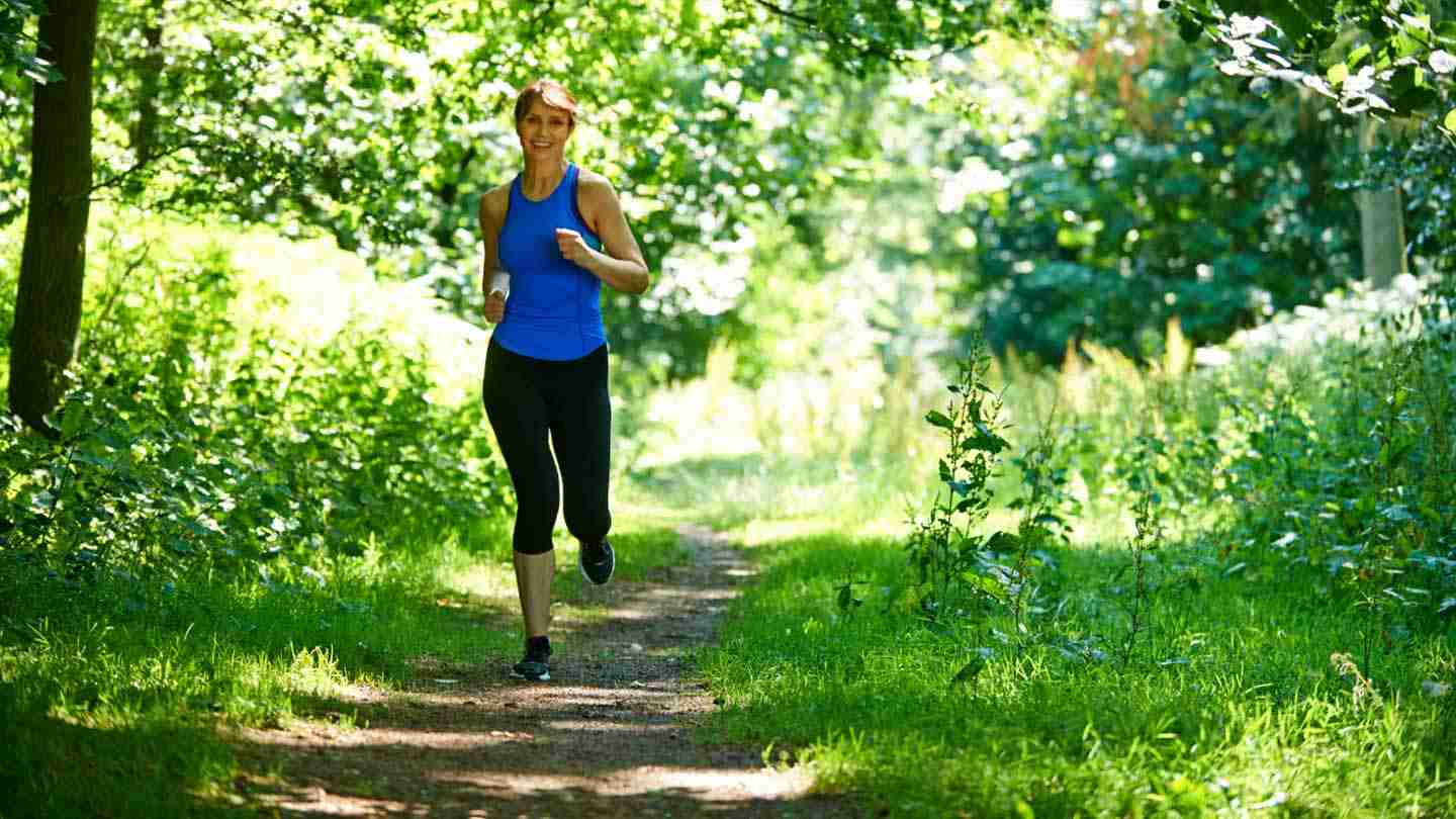 woman running in forest